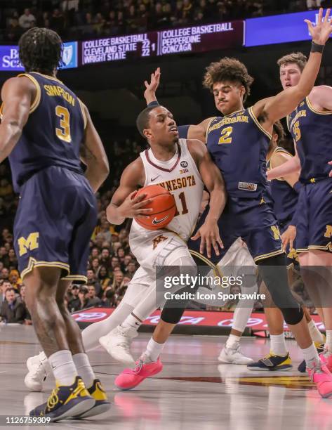 Minnesota guard Isaiah Washington drives to the basket during the game between the Michigan Wolverines and the Minnesota Gophers on February 21 at...