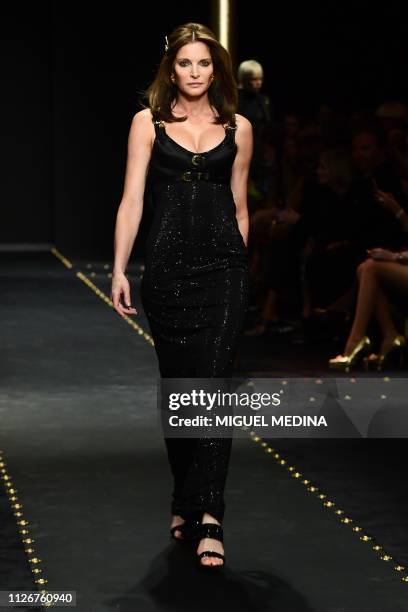 Stephanie Seymour presents a creation during the Versace women's Fall/Winter 2019/2020 collection fashion show, on February 22, 2019 in Milan.