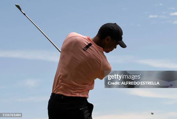 Golfer Tiger Woods practises a shot during the second round of the World Golf Championship in Mexico City, on February 22, 2019. - The WGC-Mexico...