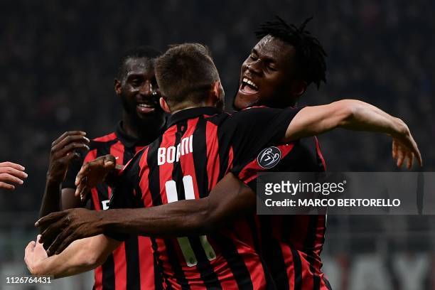 Milan's Italian forward Fabio Borini celebrates with AC Milan's French midfielder Tiemoue Bakayoko and AC Milan's Ivorian midfielder Franck Kessie...