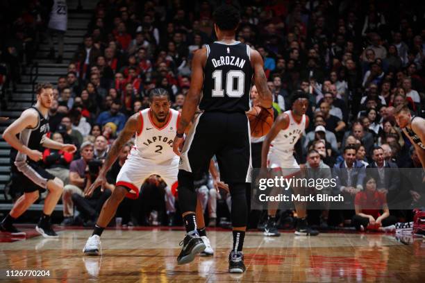 DeMar DeRozan of the San Antonio Spurs handles the ball against Kawhi Leonard of the Toronto Raptors on February 22, 2019 at the Scotiabank Arena in...