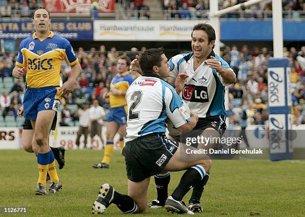 Matthew Johns of the Sharks celebrates with team mate Matt Rieck after his try during the NRL round 18 game between the Parramatta Eels and the...