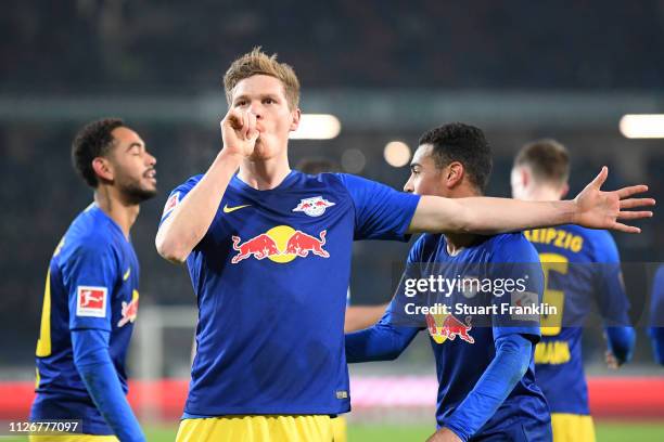 Marcel Halstenberg of RB Leipzig celebrates after scoring his team's first goal from the penalty spot during the Bundesliga match between Hannover 96...