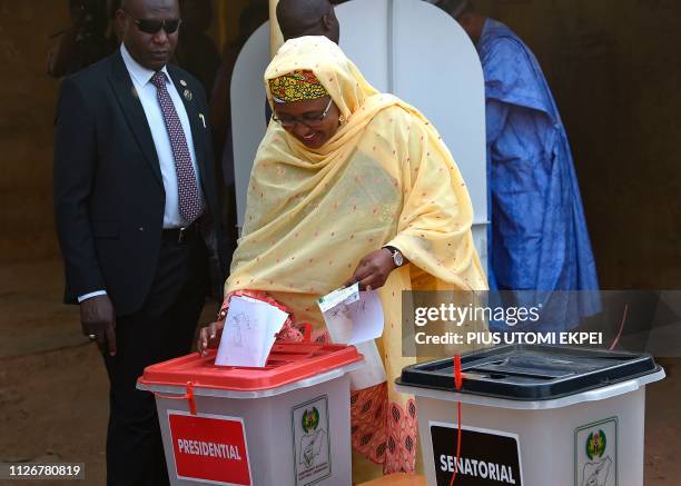 First lady Aisha Buhari, wife of candidate of the All Progressives Congress and incumbent President, casts her vote at a polling station in Daura in...