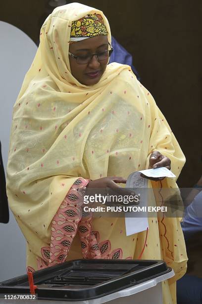 First lady Aisha Buhari, wife of candidate of the All Progressives Congress and incumbent President, casts her vote at a polling station in Daura in...
