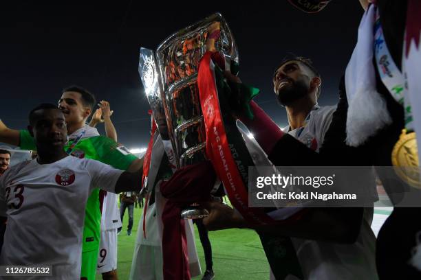 Hasan Al Haydos of Qatar lifts Asian Cup trophy after winning the AFC Asian Cup final match between Japan and Qatar at Zayed Sports City Stadium on...