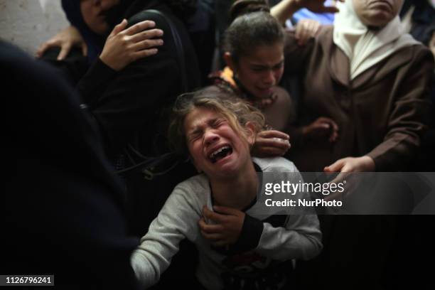 Relative of Palestinian Yussef al-Daya, aged 14, mourn over his death during his funeral in Gaza City, on February 23, 2019. - A Palestinian teenager...