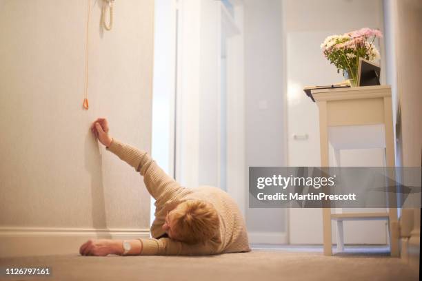reaching for emergency cord - panic button stock pictures, royalty-free photos & images