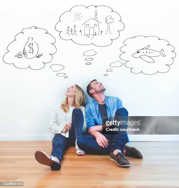 couple dreaming of family, wealth and travel. - day dreaming stock pictures, royalty-free photos & images