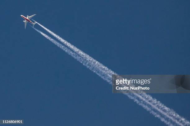 Boeing 787-8 Dreamliner of Air India overflying in the blue sky over Luxembourg at 39.000 feet. The aircraft has the registration VT-ANH and is...