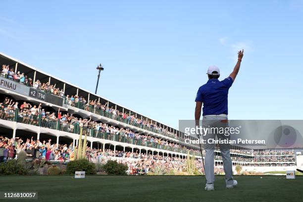 Rickie Fowler reacts with the gallery on the 16th tee during the second round of the Waste Management Phoenix Open at TPC Scottsdale on February 01,...