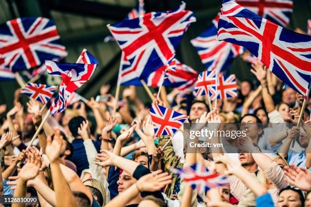 wave your flag - british flag stock pictures, royalty-free photos & images