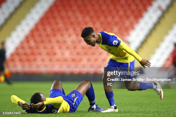 Nathan Tella of Southampton FC runs to Jonathan Afolabi after the final whistle is blown for the PL2 match between Manchester United and Southampton...