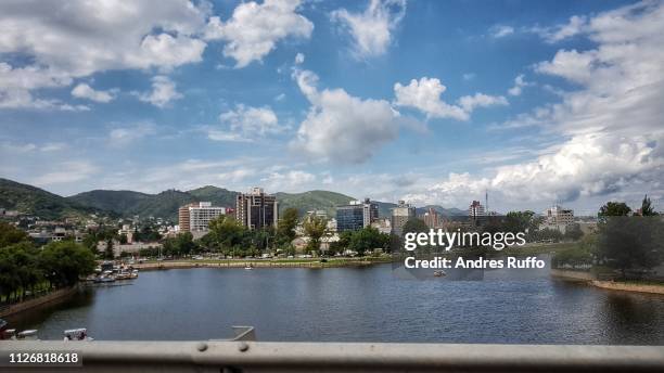 general view of san roque lake in the background city villa carlos paz, argentina - cordoba argentina stock-fotos und bilder