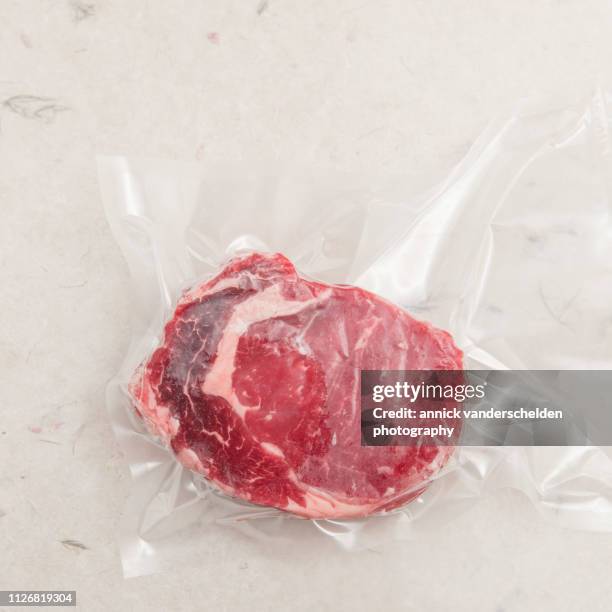 vacuum-sealed ribeye - vacuum packed stock pictures, royalty-free photos & images