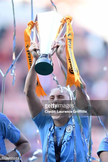 Steph Houghton of Manchester City Women lifts the trophy following the FA Women's Continental League Cup Final between Arsenal and Manchester City...