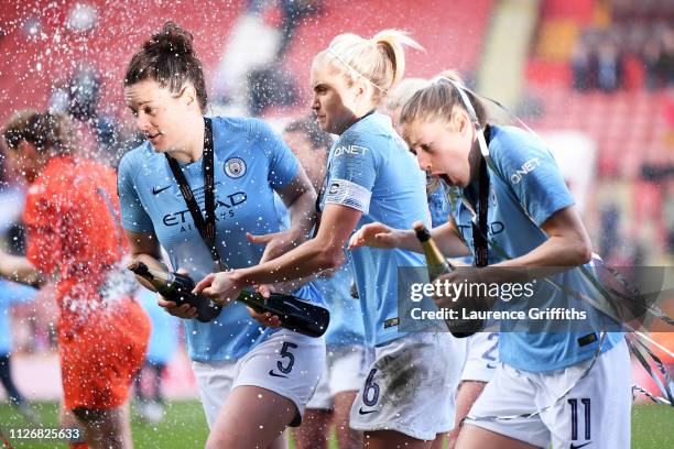 Steph Houghton, Jennifer Beattie and Janine Beckie of Manchester City Women celebrate following the FA Women's Continental League Cup Final between...