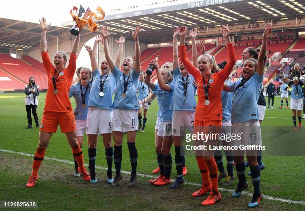 Manchester City players celebrate with the trophy following the FA Women's Continental League Cup Final between Arsenal and Manchester City Women at...