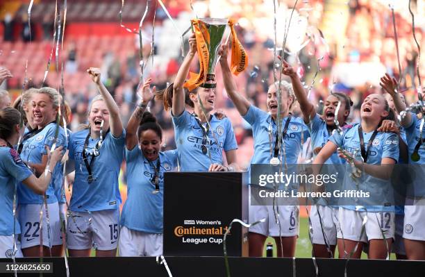 Steph Houghton and Jill Scott of Manchester City Women lift the trophy during the FA Women's Continental League Cup Final between Arsenal and...