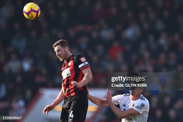 Bournemouth's English midfielder Dan Gosling vies with Wolverhampton Wanderers' Belgian midfielder Leander Dendoncker during the English Premier...