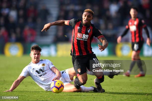 Jordon Ibe of AFC Bournemouth is challenged by Leander Dendoncker of Wolverhampton Wanderers during the Premier League match between AFC Bournemouth...