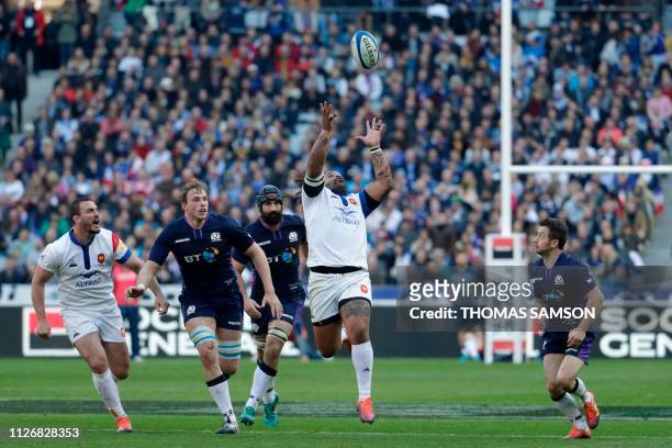 France's centre Mathieu Bastareaud catches the ball during the Six Nations rugby union tournament match between France and Scotland at the Stade de...