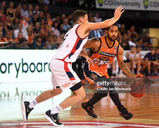 Melo Trimble of the Taipans drives to the basket past Shaun Bruce of the 36ers during the round 16 NBL match between the Cairns Taipans and the...