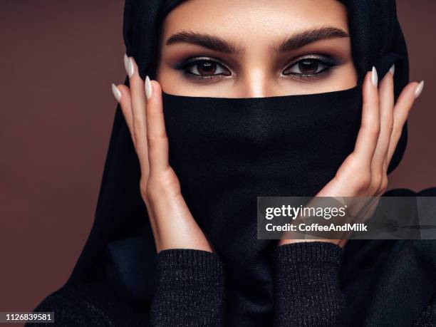 beautiful mysterious woman - saudi women stock pictures, royalty-free photos & images