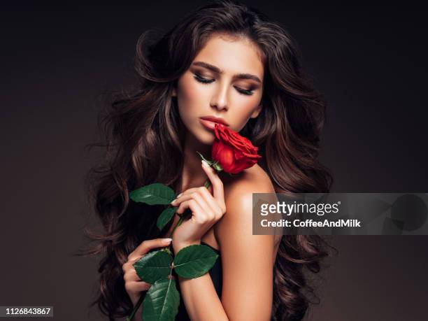 brown haired woman with curly hairstyle - teased hair stock pictures, royalty-free photos & images