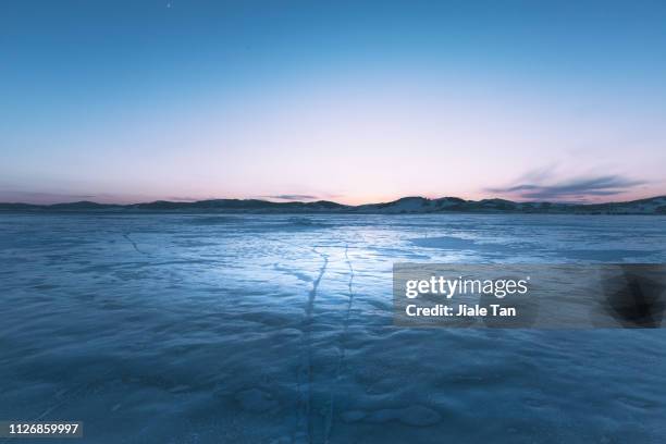 surface of a ice lake, china. - water surface line stock pictures, royalty-free photos & images