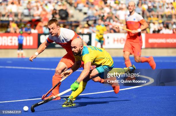 Matthew Swann of Australia looks to pass the ball during the Men's FIH Field Hockey Pro League match between Australia and the Netherlands at State...