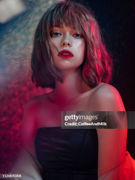 beautiful fashionable woman with multicolor highlights on her face - red lips stock pictures, royalty-free photos & images