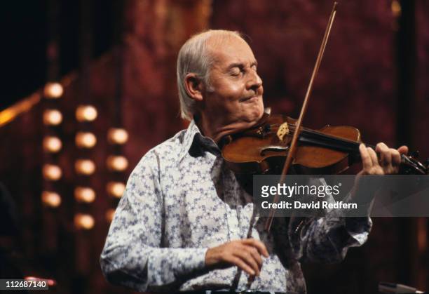 Stephane Grappelli , French jazz violinist, performing live on stage, circa 1980. Grappelli founded the Quintette du Hot Club de France with...