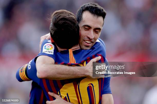 Lionel Messi of FC Barcelona celebrates 2-3 with Sergio Busquets of FC Barcelona during the La Liga Santander match between Sevilla v FC Barcelona at...