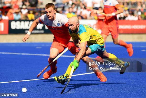 Matthew Swann of Australia looks to pass the ball during the Men's FIH Field Hockey Pro League match between Australia and the Netherlands at State...