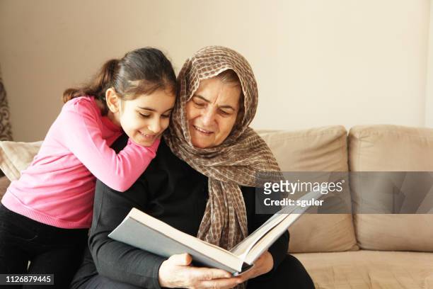 grandmother and granddaughter - west asia stock pictures, royalty-free photos & images