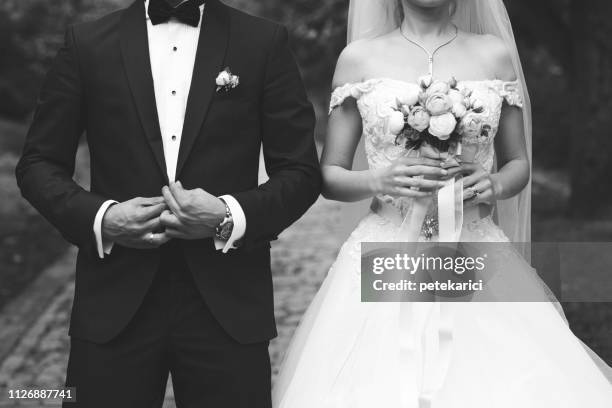 bride and groom - black and white holding hands stock pictures, royalty-free photos & images