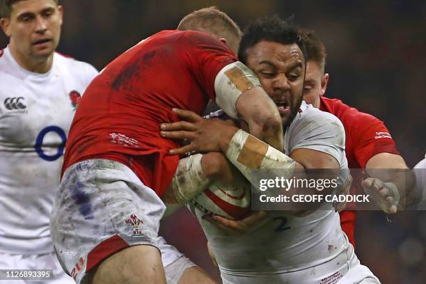 England's number 8 Billy Vunipola is tackled by Wales' centre Hadleigh Parkes during the Six Nations international rugby union match between Wales...