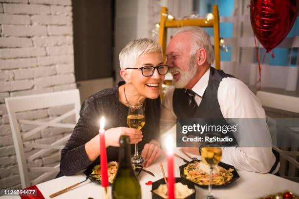 romantic mature couple having dinner - valentines day dinner stock pictures, royalty-free photos & images