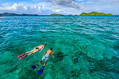 Young couple snorkeling on East China Sea, Philippines