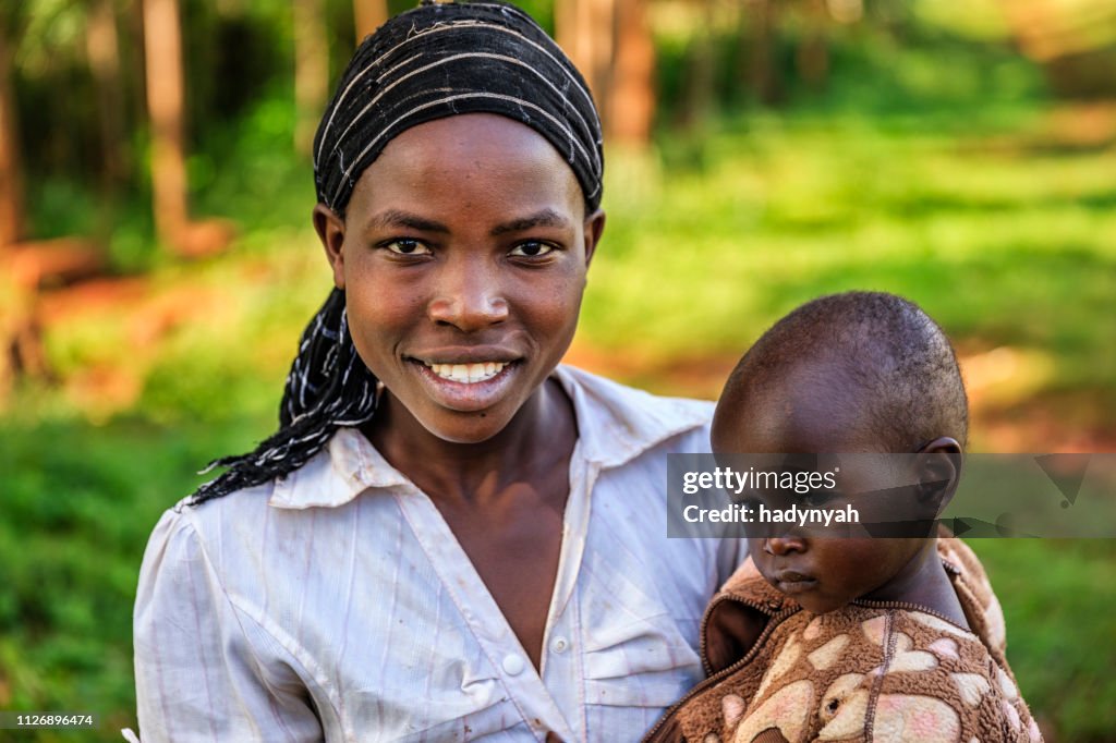 Young African woman holding her baby, Kenya, East Africa