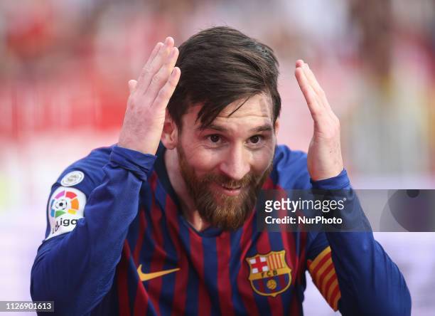 Lionel Messi of Barcelona celebrates after scoring his team's second goal with his teammate Ousmane Dembele during the La Liga match between Sevilla...