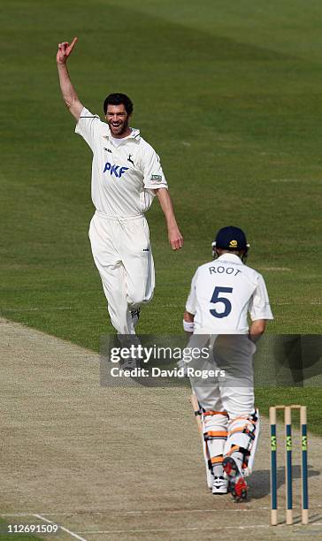 Charlie Shreck of Nottinghamshire celebrates after taking the wicket of Joe Root during the LV County Championship match between Yorkshire and...