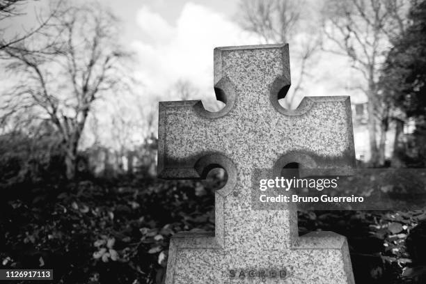 stone cross on tombe at cemetery - file graveyard fields 3.jpg stock pictures, royalty-free photos & images