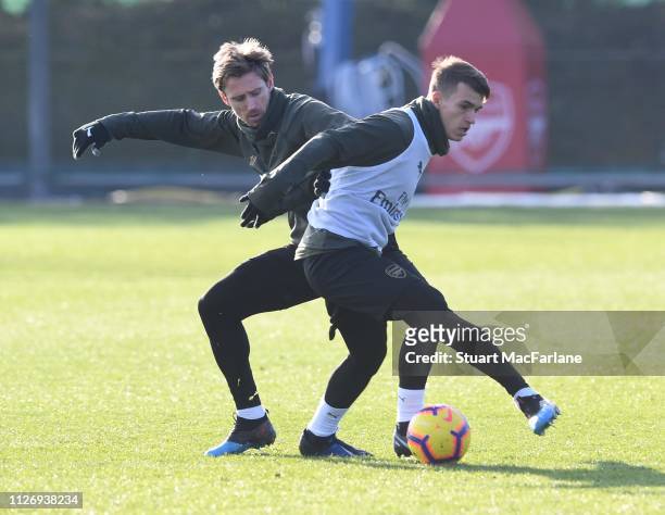 Nacho Monreal and Denis Suarez of Arsenal during a training session at London Colney on February 02, 2019 in St Albans, England.