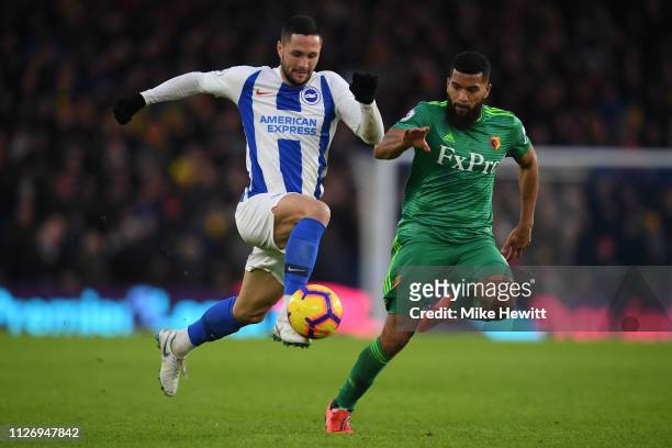 Florin Andone of Brighton & Hove Albion gets away from Adrian Mariappa of Watford during the Premier League match between Brighton & Hove Albion and...