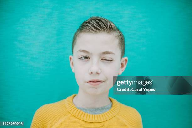 boy winking eye - child eyes closed stock pictures, royalty-free photos & images