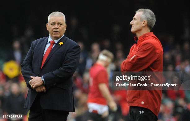 Wales' Head Coach Warren Gatland chats to Rob Howley during the pre match warm up during the Guinness Six Nations match between Wales and England at...