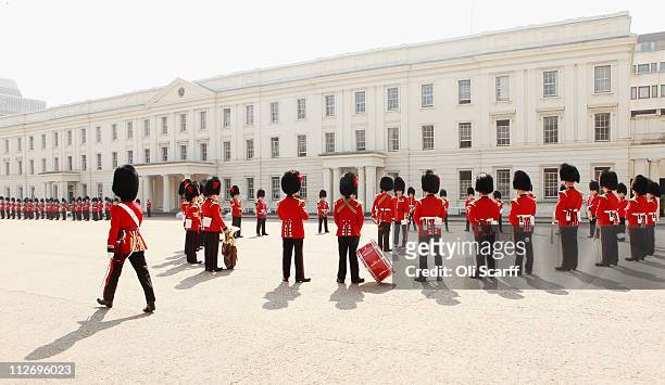 Soldiers of the Coldstream Guards Band and the Queen's Guard parade in Wellington Barracks before taking part in Changing the Guard in Buckingham...