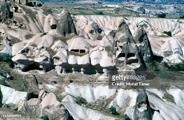 rock cut dwellings in cappadocia - rock hoodoo stockfoto's en -beelden